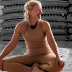 Yoga with Jo sitting on mat crossed legged